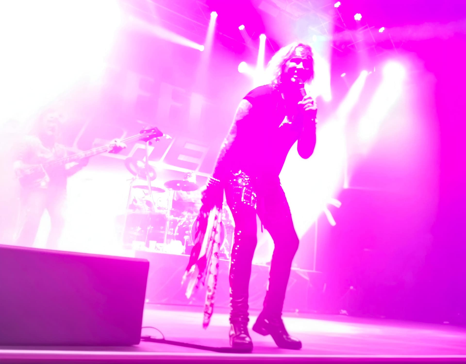 Michael Starr silhouetted against magenta stage lighting at the Nick Rayns LCR